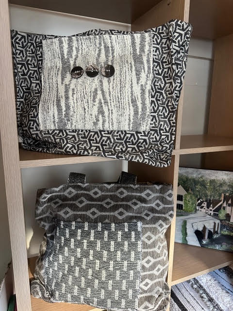 Handmade handbags in patterned grey and black woven fabrics
