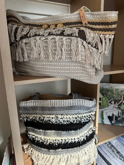 Fringed handmade handbags in cream, grey and black textured weaves