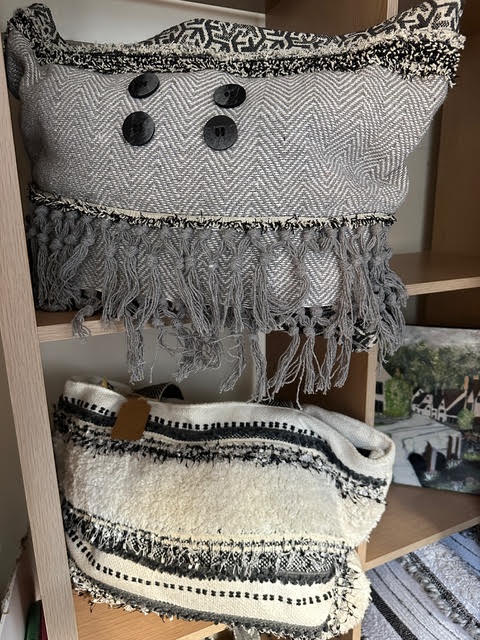 Handmade handbags with wooden buttons and tasselled fringing